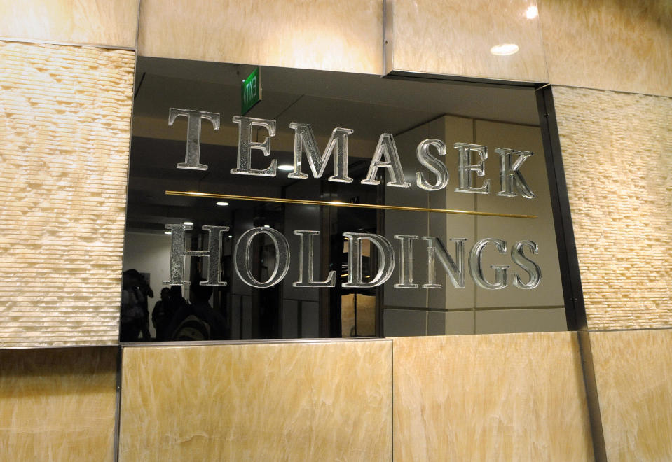 This photo taken on February 6, 2009 shows a sign outside the Singapore state investment arm Temasek Holdings office in Singapore. Temasek Holdings' portfolio lost more than 40 billion Singapore dollars (27.72 billion USD) in value as of end-March from a year before, the state investment firm's chief executive said on July 29, 2009.     AFP PHOTO / ROSLAN RAHMAN (Photo credit should read ROSLAN RAHMAN/AFP via Getty Images)