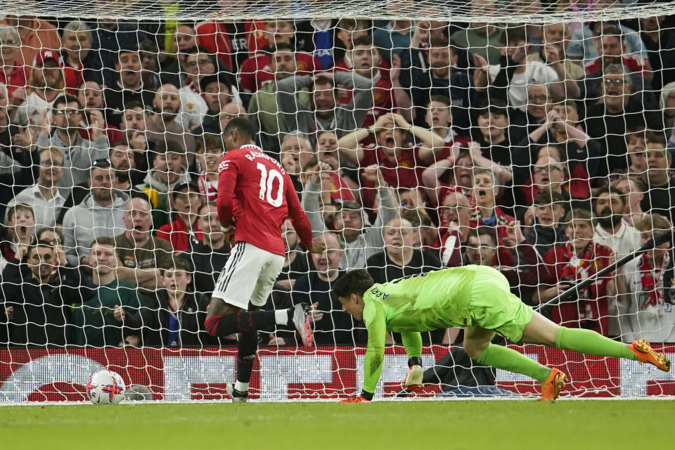 Chelsea's goalkeeper Kepa Arrizabalaga, right, fails to save the goal from Manchester United's Marcus Rashford during the English Premier League soccer match between Manchester United and Chelsea at the Old Trafford stadium in Manchester, England, Thursday, May 25, 2023. (AP Photo/Dave Thompson)