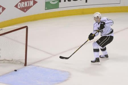 Apr 30, 2014; San Jose, CA, USA; Los Angeles Kings right wing Dustin Brown (23) scores an empty net goal against the San Jose Sharks during the third period in game seven of the first round of the 2014 Stanley Cup Playoffs at SAP Center at San Jose. Kyle Terada-USA TODAY Sports