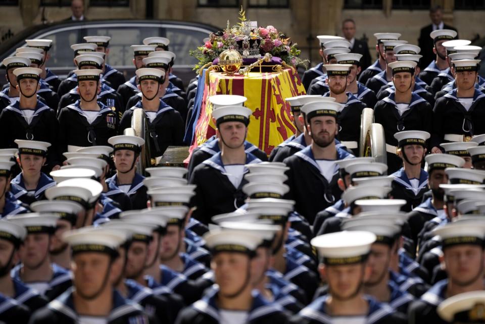 The coffin of Queen Elizabeth II departs Westminster Abbey.