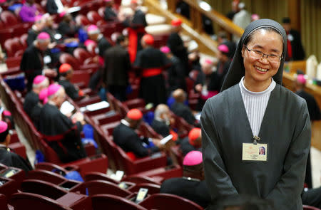 Korean nun Mina Kwon smiles before the start of the synod afternoon session led by Pope Francis at the Vatican October 16, 2018. Picture taken October 16, 2018. REUTERS/Max Rossi