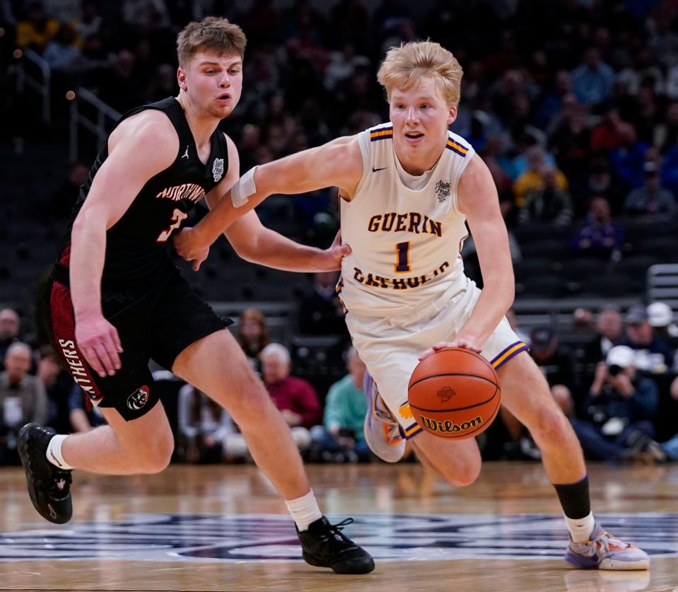 Guerin Catholic Golden Eagles Jack Cherry (1) rushes up the court against NorthWood Panthers Cade Brenner (3) on Saturday, March 25, 2023 at Gainbridge Fieldhouse in Indianapolis. The NorthWood Panthers lead at the half against the Guerin Catholic Golden Eagles, 66-63, in the IHSAA Class 3A state finals championship. 
