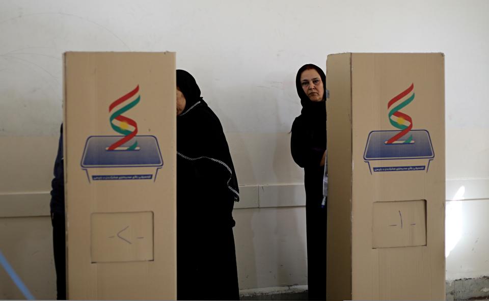 Iraqi Kurdish women cast their ballots during parliamentary elections, in Irbil, Iraq, Sunday, Sept. 30, 2018. Iraq's self-ruled Kurdish region was holding long-delayed parliamentary elections on Sunday, a year after a vote for independence sparked a punishing backlash from Baghdad, leaving Kurdish leaders deeply divided. (AP Photo)