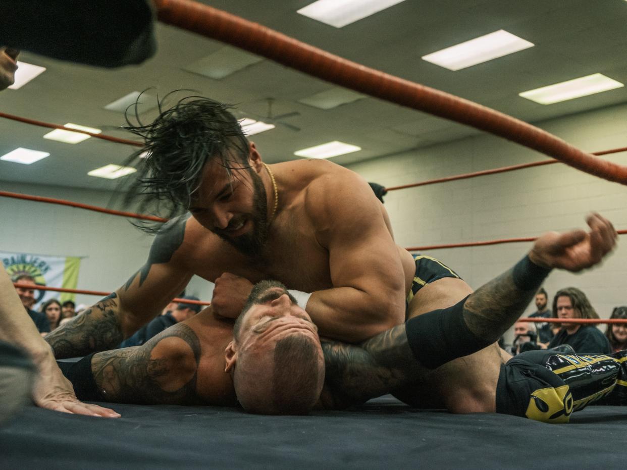 IWR Superstar Top Notch Jason Hotch throws elbows at Impact Wrestling Superstar Deaner during the Cinco De Mayhem event in Monroe.