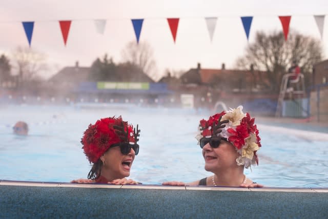 Jessica Walker and Nicola Foster, known as the Lido Ladies, swim at Charlton Lido in Hornfair Park, London, on its first day of reopening (VIctoria Jones/PA)