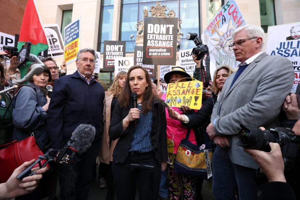 Stella Morris the wife of Julian Assange talks to the media outside Westminster Magistrates' Court in London, after the Wikileaks founder was formally issued with an order for extradition to the US to face espionage charges (PA)