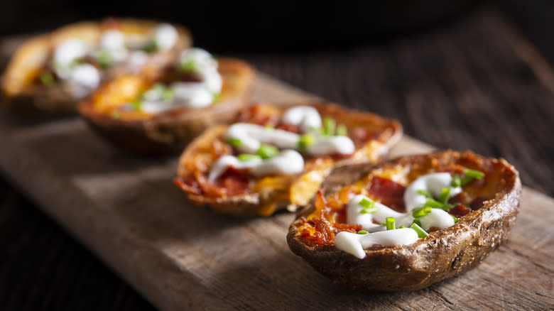 Potato skins on cutting board