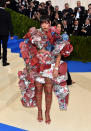 <p>The singer wore a multi-colored Comme des Garçons ensemble from the label’s fall 2016 collection. She completed the look with red thigh-high sandals. (Photo by John Shearer/Getty Images) </p>