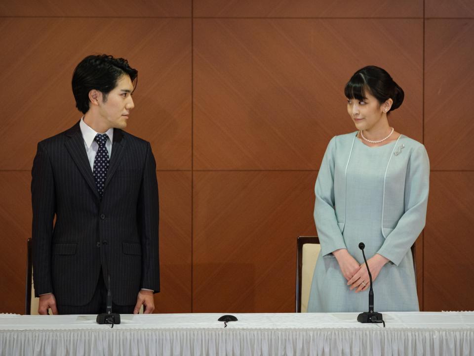 Princess Mako, the elder daughter of Prince Akishino and Princess Kiko, and her husband Kei Komuro, a university friend of Princess Mako, poses during a press conference to announce their wedding at Grand Arc Hotel on October 26, 2021 in Tokyo, Japan