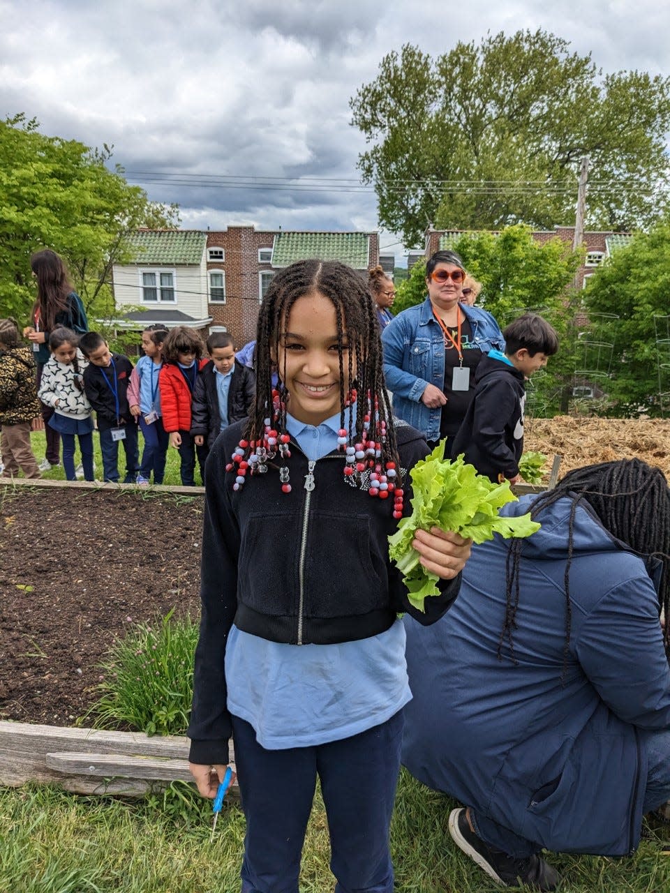 Healthy Foods for Healthy Kids and William C. Lewis Dual Language Elementary School celebrate the students’ first spring harvest at the Rodney Reservoir Community Garden in Wilmington, Delaware, on May 4, 2023. The partnership has created an "outdoor classroom" experience for students of the magnet elementary school.