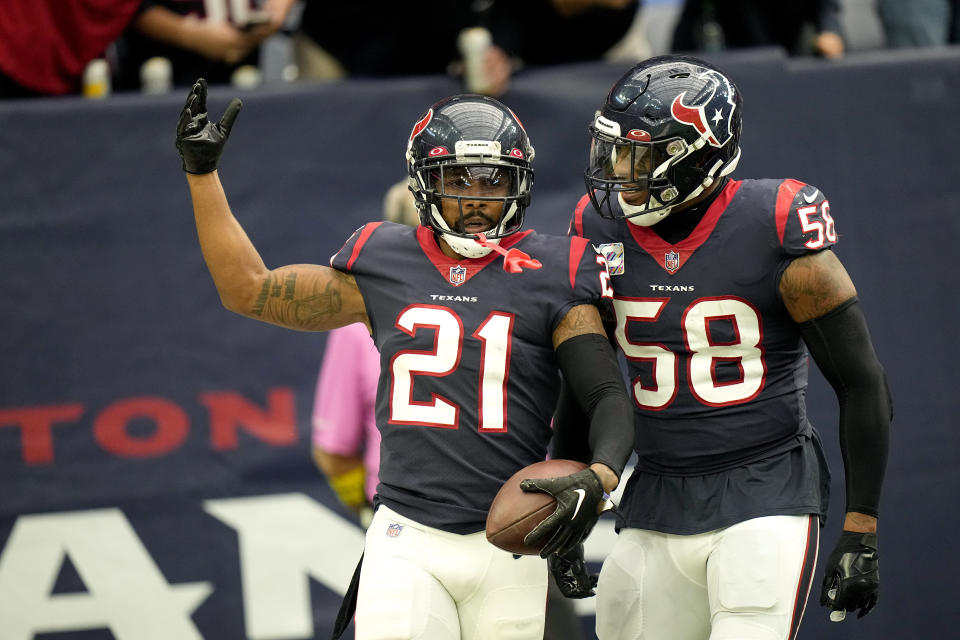 Houston Texans cornerback Steven Nelson (21) celebrates with linebacker Christian Kirksey (58) after Nelson intercepted a pass against the Tennessee Titans during the first half of an NFL football game Sunday, Oct. 30, 2022, in Houston. (AP Photo/Eric Gay)