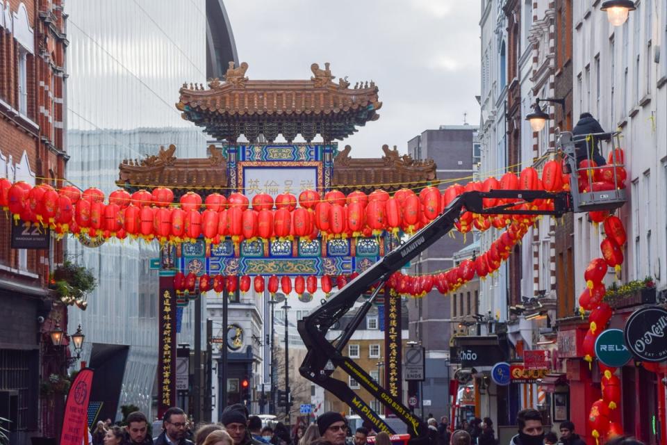 Workers install new red lanterns in Chinatown ahead of Chinese New Year (SOPA Images/LightRocket via Gett)