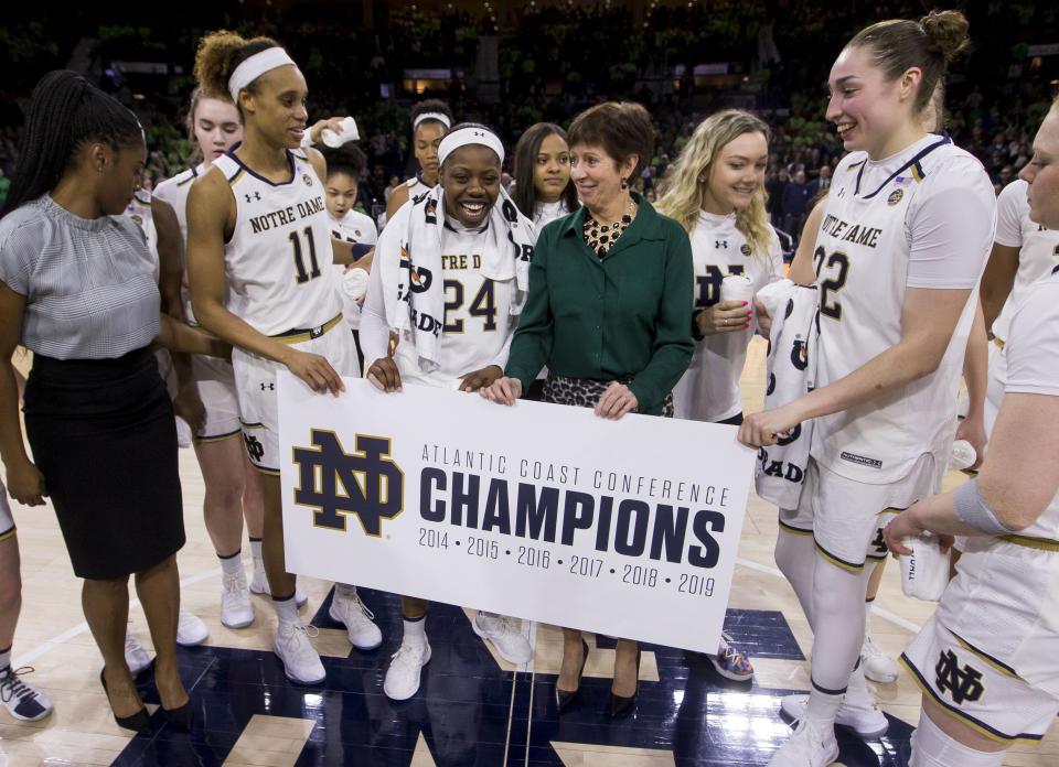 Notre Dame head coach Muffet McGraw celebrate on the court after clinching the regular season ACC conference championship following an NCAA college basketball game against Virginia Sunday, March 3, 2019, in South Bend, Ind. Notre Dame won 103-66. (AP Photo/Robert Franklin)