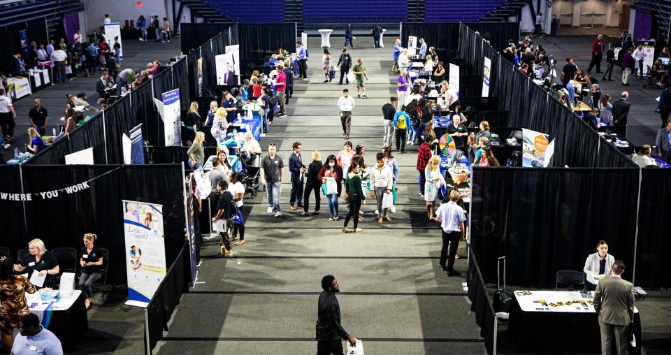 Job seekers meet with potential employers at a regional career fair hosted by Career Source Southwest Florida on Tuesday, April 5, 2022 at Suncoast Arena on the FSW campus in Fort Myers.  