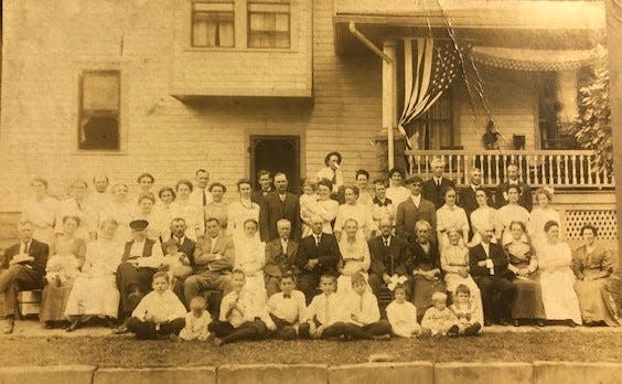 The Rudgers family takes a portrait at a reunion in the early 20th century. The location is unknown.