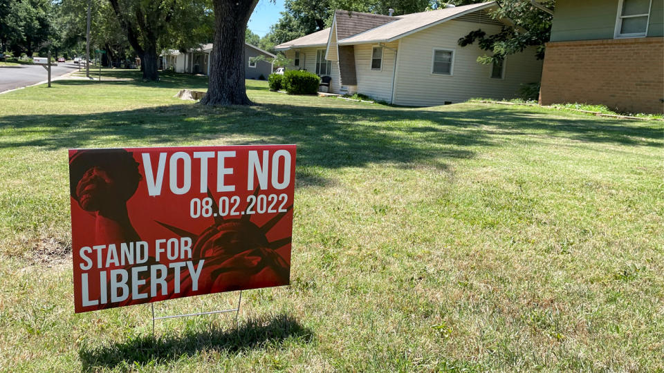 A yard sign reads: Vote no, 08.02.2022, stand for liberty.