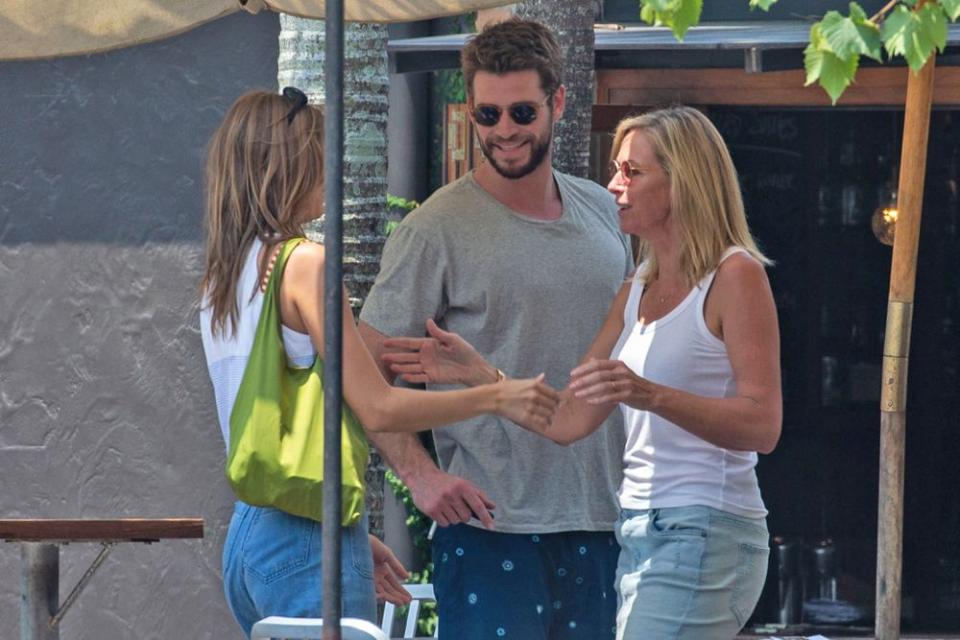 Gabriella Brooks (left) and Liam Hemsworth with his mother Leonie | Media-Mode/SplashNews.com