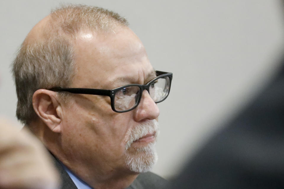 Defendant Gregory McMichael looks on during his trial at the Glynn County Courthouse, Friday, Nov. 19, 2021, in Brunswick, Ga. Greg McMichael and his son, Travis McMichael, and a neighbor, William "Roddie" Bryan are charged with the February 2020 slaying of 25-year-old Ahmaud Arbery. (Octavio Jones/Pool Photo via AP)