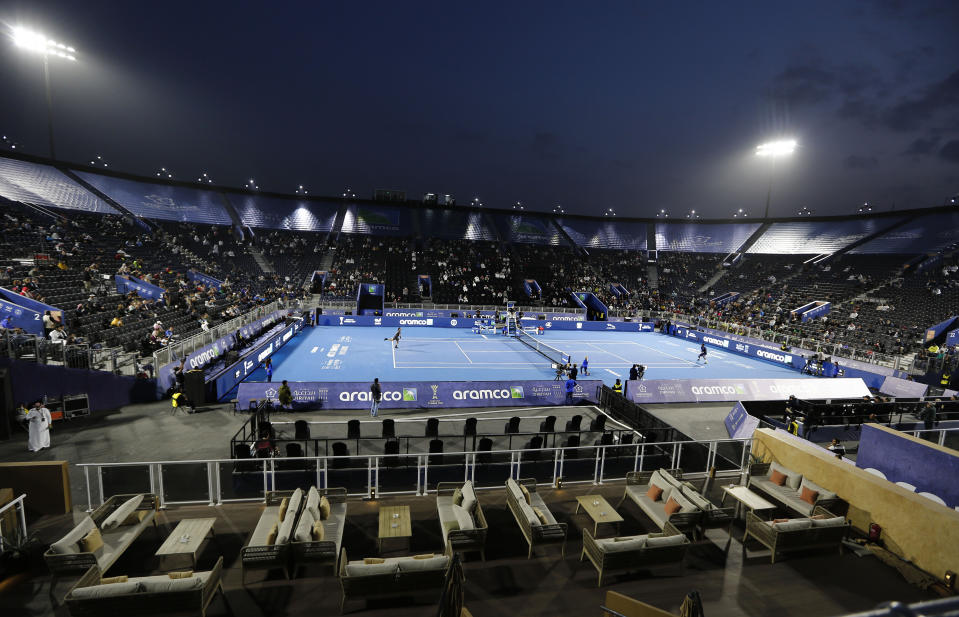 FILE - Fabio Fognini, of Italy, left, plays against Gael Monfils, of France, at the Diriyah tourist site in Riyadh, Saudi Arabia, Dec. 13, 2019. Saudi Arabia's Public Investment Fund and the men's professional tennis tour announced a multiyear partnership on Wednesday, Feb. 28, 2024, that includes naming rights for the ATP rankings, the latest move into sports by the kingdom. (AP Photo/Amr Nabil, File)