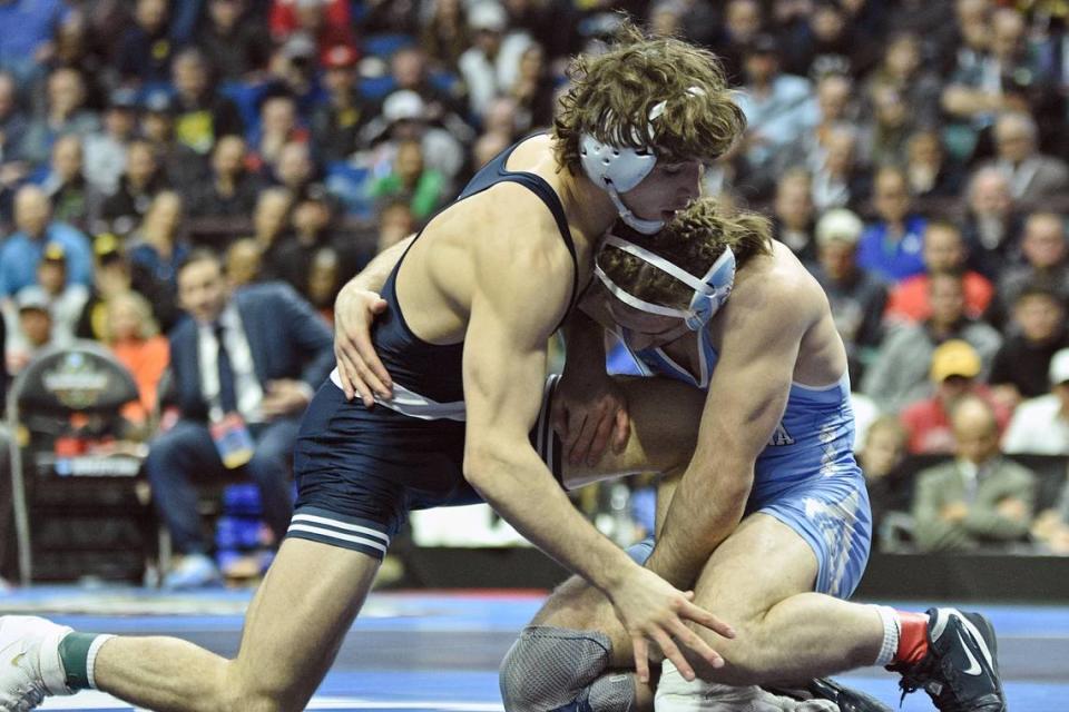 Penn State’s Levi Haines tries to defend a shot from North Carolina’s Austin O’Connor in their 157-pound finals match of the NCAA Championships on Saturday, March 18, 2023 at the BOK Center in Tulsa, Okla. O’Connor topped Haines, 6-2, to win the title.