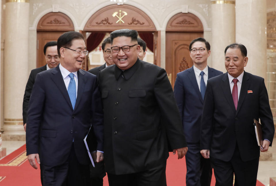 In this Wednesday, Sept. 5, 2018 photo provided on Thursday, Sept. 6, 2018 by South Korea Presidential Blue House via Yonhap News Agency, North Korean leader Kim Jong Un, second from left, talks with South Korean National Security Director Chung Eui-yong, left, in Pyongyang, North Korea. A South Korean delegation met with North Korean leader Kim Jong Un on Wednesday during a visit to arrange an inter-Korean summit planned for this month and help rescue faltering nuclear diplomacy between Washington and Pyongyang. (South Korea Presidential Blue House/Yonhap via AP)