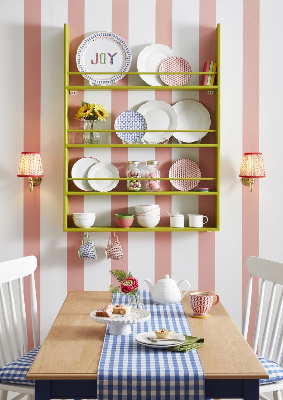 dining area with striped pink and white wallpaper