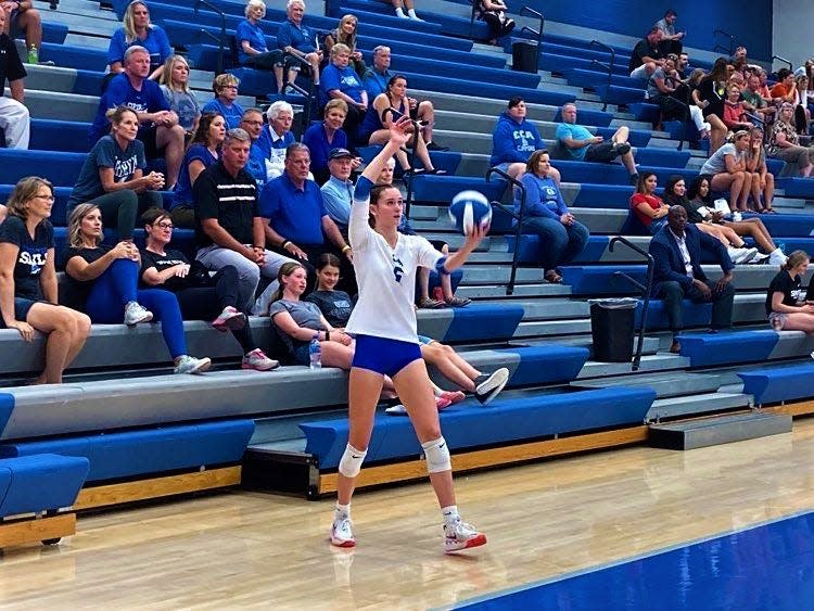 Clear Creek Amana's Bliss Beck prepares to serve against West Branch on Tuesday.