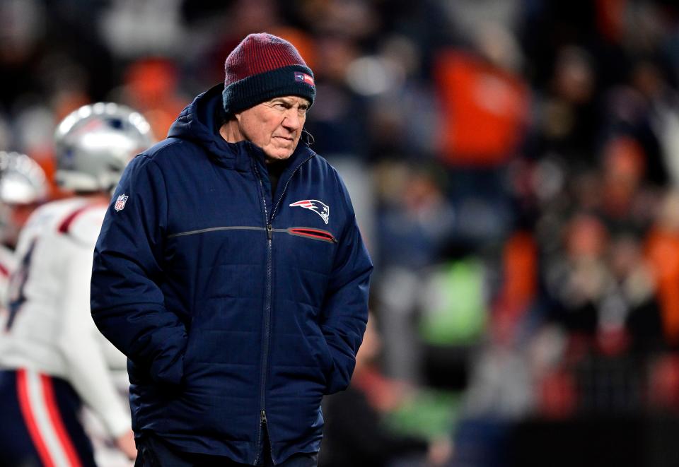 DENVER, COLORADO - DECEMBER 24:  Head coach Bill Belichick of the New England Patriots walks onto the field prior to the game against the Denver Broncos at Empower Field At Mile High on December 24, 2023 in Denver, Colorado. (Photo by Dustin Bradford/Getty Images)