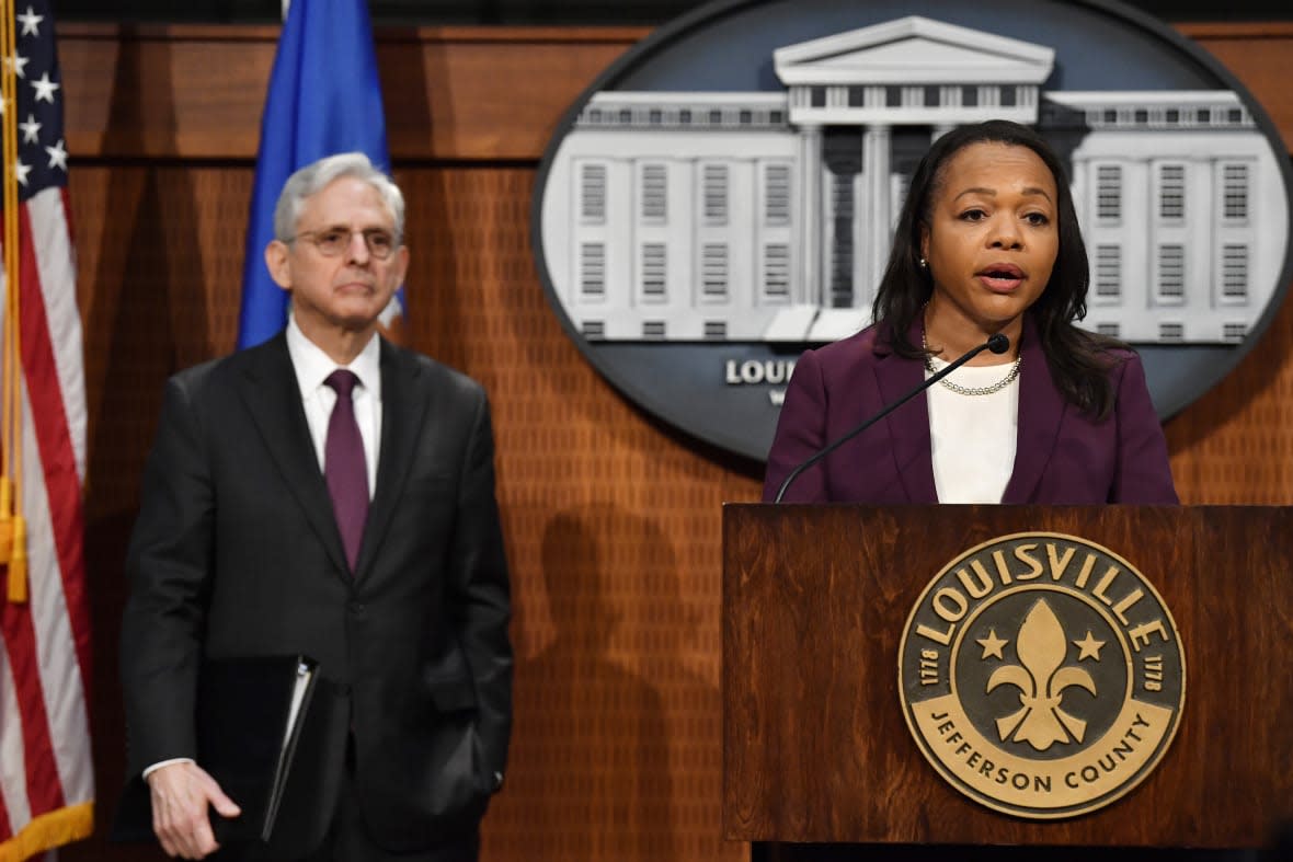 U.S. Assistant Attorney General Kristen Clarke, right speaks during a press conference at Louisville Metro Hall in Louisville, Ky., Wednesday, March 8, 2023. (AP Photo/Timothy D. Easley)