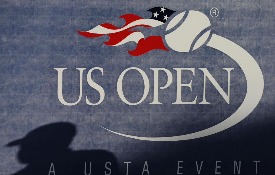 A shadow is cast on a court during the first round of play at the 2012 U.S. Open tennis tournament, Monday, Aug. 27, 2012, in New York. An outside review of the U.S. Tennis Association’s safeguarding system makes 19 specific recommendations for how the group that oversees the sport in the country and runs the U.S. Open Grand Slam tournament can do more to protect players from abuse such as sexual misconduct. A 62-page report written by two lawyers was presented to the USTA Board of Directors last week and made public Thursday, June 27, 2024. (AP Photo/Darron Cummings, File)