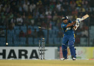 Sri Lankan batsman Angelo Perera is bowled out by Bangladesh captain Mashrafe Bin Mortaza during the second T20 cricket match between Bangladesh and Sri Lanka at The Zahur Ahmed Chowdhury Stadium in Chittagong on February 14, 2014. AFP PHOTO/ Munir uz ZAMAN