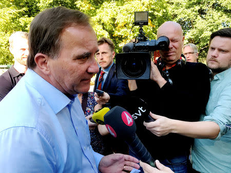 Sweden's Prime Minister Stefan Lofven speaks to the media during his campaign in the Farsta neighbourhood in Stockholm, Sweden September 3, 2018. REUTERS/Daniel Dickson