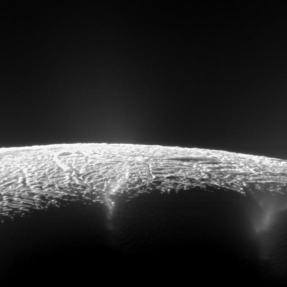 A view from NASA's Cassini spacecraft looking across the geyser basin near the south pole of Saturn's moon Enceladus, along fractures spewing water vapor and ice particles into space.