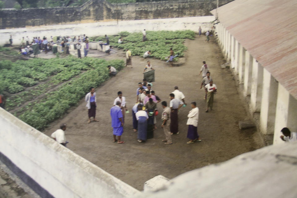This late 2000s photo provided by the Assistance Association of Political Prisons for Myanmar shows men in the courtyard of a prison in Thayat, Myanmar. The military has a long history of torture, particularly before the country began transitioning toward democracy in 2010. (AAPP via AP)