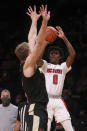 North Carolina State's Terquavion Smith (0) shoots against Purdue's Caleb Furst during the first half of an NCAA college basketball game Sunday, Dec. 12, 2021, in New York. (AP Photo/Jason DeCrow)