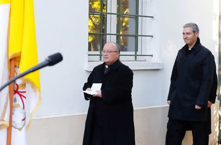 Special Vatican envoys archbishop Charles Scicluna and father Jordi Bertomeu attend a news conference in Santiago, Chile June 12, 2018. REUTERS/Rodrigo Garrido