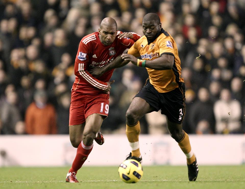 Liverpool's Ryan Babel (left) and Wolverhampton Wanderers' George Elokobi (right) battle for the ball   (Photo by Peter Byrne/PA Images via Getty Images)