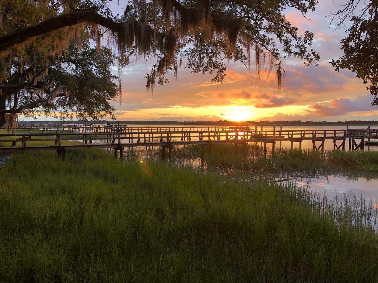 Sunset with sea grass, wooden piers and estuary in Beaufort County, South Carolina