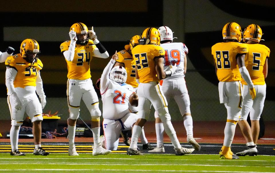 Nov 18, 2022; Tempe, AZ, USA; Thunderbird Titans fullback Greg Smith (21) reacts after scoring the game winning touchdown against the Marcos de Niza Padres during a 4A playoff game at Marcos de Niza High. Mandatory Credit: Rob Schumacher-Arizona Republic