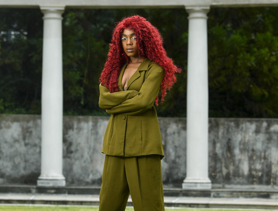 This Aug. 19, 2019 photo shows music artist Buku Abi, born Joann Kelly, posing in Atlanta. As the daughter of R. Kelly, she experienced her fair share of hardships. She is no longer in touch with him and says being R. Kelly's daughter is like "a double-edged sword." In March, Abi released her debut EP "Don't Call Me" and she appeared on the WEtv reality series, "Growing Up Hip Hop: Atlanta." (AP Photo/John Amis)