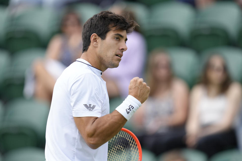 Chile's Cristian Garin celebrates winning a point against Jenson Brooksby of the US in a men's third round singles match on day six of the Wimbledon tennis championships in London, Saturday, July 2, 2022. (AP Photo/Kirsty Wigglesworth)