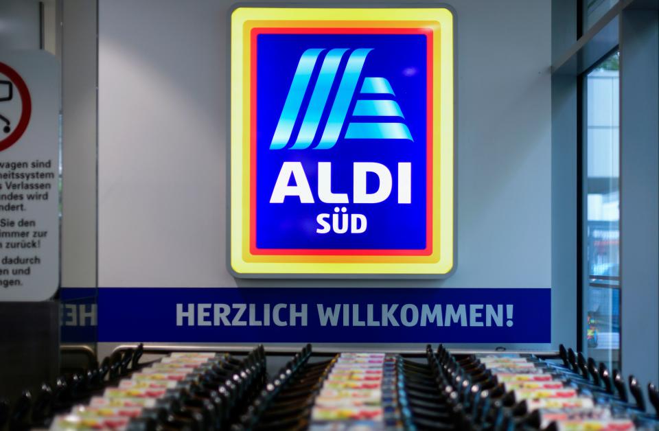 Shopping carts stand under a logo of food discounter ALDI-Sued at the entrance of a shop in Duesseldorf, western Germany, on April 29, 2020 amid the novel coronavirus COVID-19 pandemic. - From April 29, 2020 in Germany, masks are needed to enter shops, which began to open last week after the government declared its outbreak under control. Nose and mouth coverings are already compulsory on buses, trains and trams. (Photo by Ina FASSBENDER / AFP) (Photo by INA FASSBENDER/AFP via Getty Images)