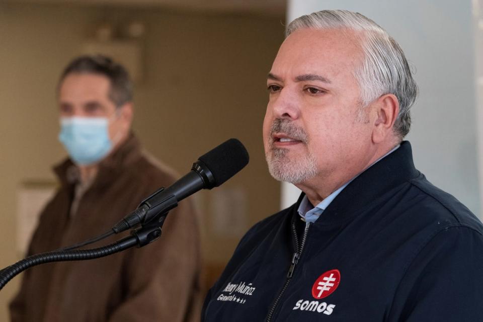 <div class="inline-image__caption"><p>Muñoz is joined by New York Governor Andrew Cuomo as he speaks to reporters during a news conference at a COVID-19 pop-up vaccination site in William Reid Apartments in Brooklyn, New York City, U.S., January 23, 2021</p></div> <div class="inline-image__credit">Mary Altaffer/Pool via REUTERS</div>