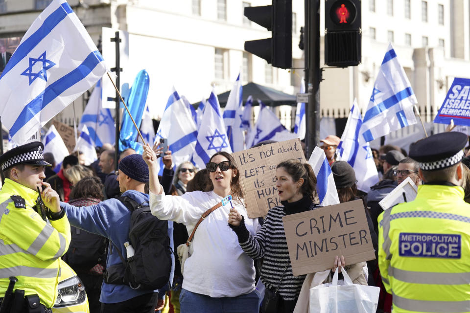 Demonstrators protest against Israeli Prime Minister Benjamin Netanyahu's visit, on Whitehall in London, Friday, March 24, 2023. British Prime Minister Rishi Sunak has welcomed Israeli leader Benjamin Netanyahu to his Downing Street office while demonstrators gathered nearby to protest Netanyahu's right-wing policies. (Stefan Rousseau/PA Wire/PA via AP)