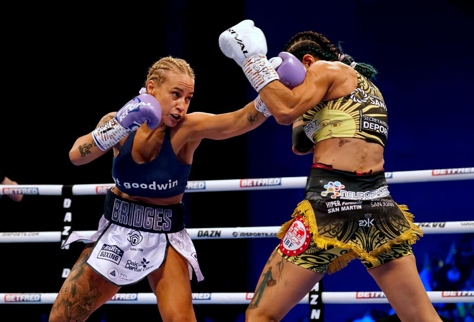 Ebanie Bridges (left) in action against Maria Cecilia Roman during their IBF World Bantamweight Title fight at the First Direct Arena, Leeds. Picture date: Saturday March 26, 2022. (Photo by Martin Rickett/PA Images via Getty Images)