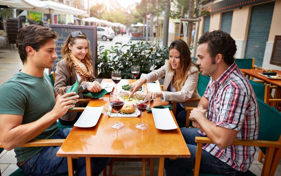 Friends having tapas at restaurant