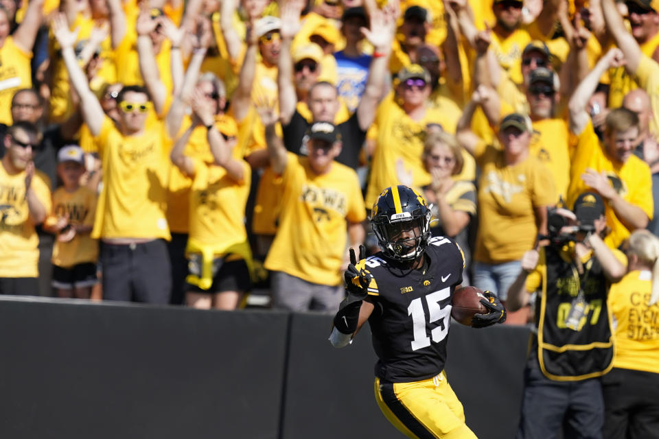 Iowa running back Tyler Goodson (15) celebrates as he scores on a 46-yard touchdown run during the first half of an NCAA college football game against Kent State, Saturday, Sept. 18, 2021, in Iowa City, Iowa. (AP Photo/Charlie Neibergall)