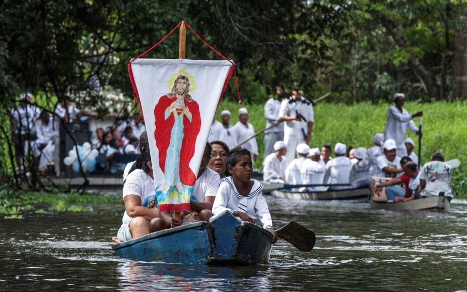 Catholic pilgrims in the Caraparu River in Santa Izabel do Para - REUTERS