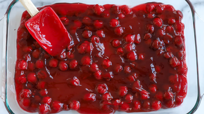 cherry pie filling in a glass pan