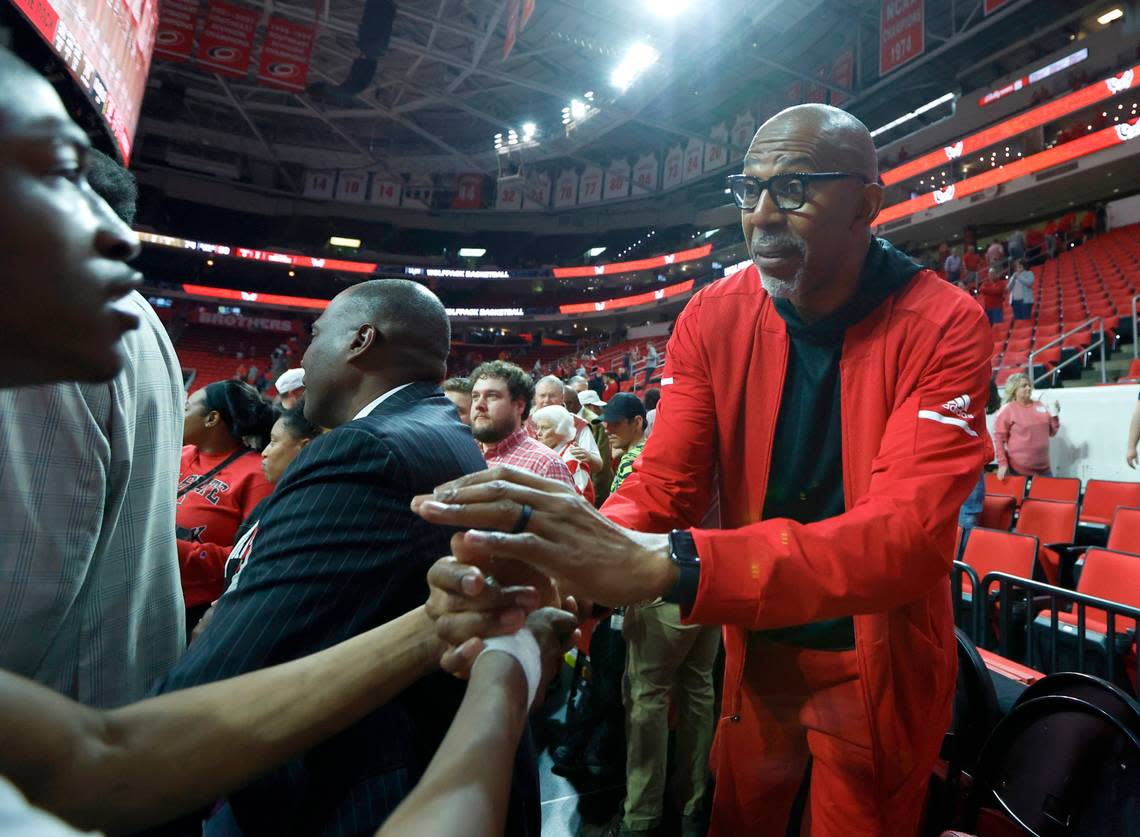 N.C. State’s Thurl Bailey, a member of the 1983 national championship team, congratulates Jarkel Joiner after N.C. State’s 90-74 victory over Wake Forest at PNC Arena in Raleigh, N.C., Wednesday, Feb. 22, 2023.